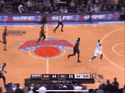 A Basketball Game Is Being Played Between The New York Knicks And Miami Heat GIF