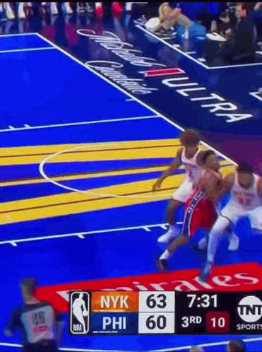 A Basketball Game Is Being Played Between The Nyk And Phi GIF