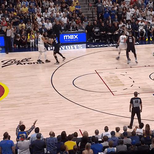 A Basketball Game Is Being Played In A Ball Arena GIF