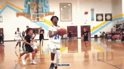 A Basketball Game Is Being Played In A Gym With A Banner On The Wall That Says Home Of The Bears GIF