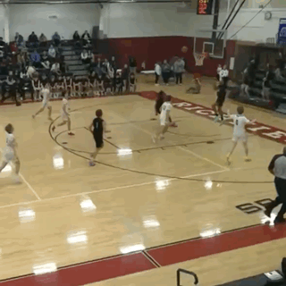 A Basketball Game Is Being Played In A Gym With A Scoreboard That Says ' Ric ' On It GIF