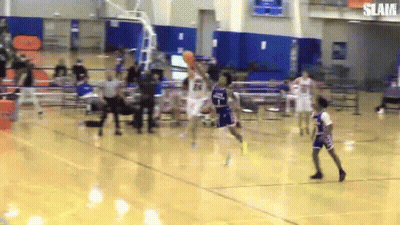 A Basketball Game Is Being Played In A Gym With The Word Slam On The Bottom Right GIF