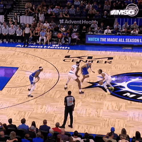A Basketball Game Is Being Played In A Stadium Sponsored By Advent Health GIF