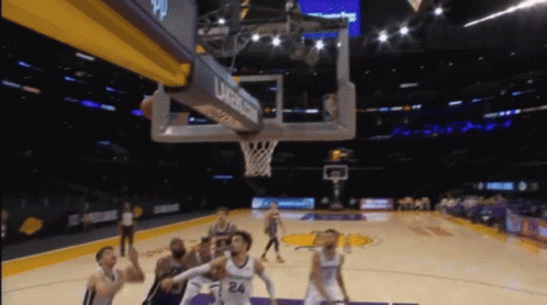 A Basketball Game Is Being Played In A Stadium Sponsored By Urassa GIF