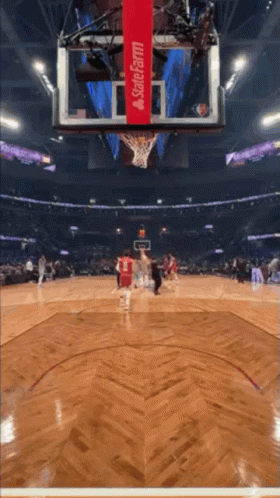 A Basketball Game Is Being Played In A Stadium That Is Sponsored By State Farm GIF