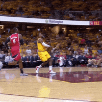 A Basketball Game Is Being Played In A Stadium That Says Cle On It GIF