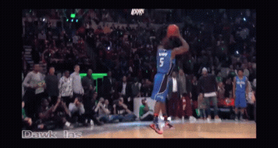 A Basketball Game Is Being Played In A Stadium With A Crowd Watching GIF