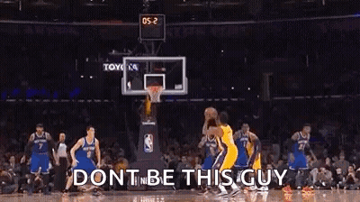 A Basketball Game Is Being Played In A Stadium With A Crowd Watching . GIF