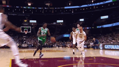 A Basketball Game Is Being Played In A Stadium With A Gatorade Ad In The Background . GIF