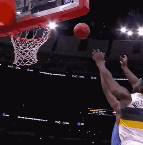 A Basketball Game Is Being Played In A Stadium With A Sign That Says Windy City GIF