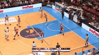 A Basketball Game Is Being Played In A Stadium With A Unisys Logo On The Floor GIF