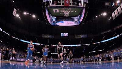 A Basketball Game Is Being Played In A Stadium With Ads For State Farm And Mdf Bank GIF