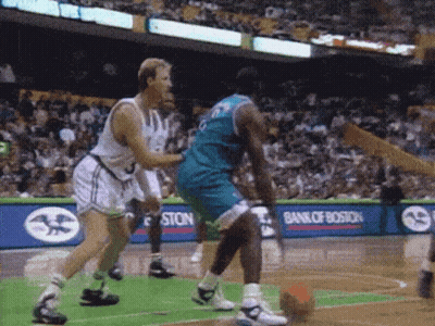 A Basketball Game Is Being Played In Front Of A Bank Of Boston Ad GIF