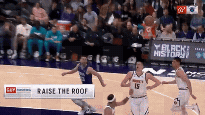 A Basketball Game Is Being Played In Front Of A Banner That Says Black History GIF