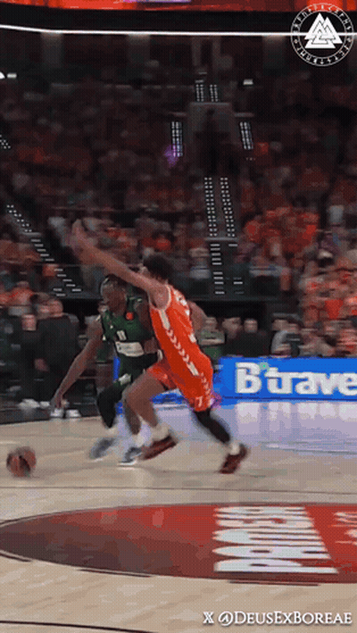 A Basketball Game Is Being Played In Front Of A Banner That Says Bravae GIF