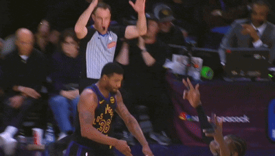 A Basketball Game Is Being Played In Front Of A Banner That Says Nbc Peacock GIF