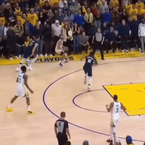 A Basketball Game Is Being Played In Front Of A Banner That Says ' Playoffs ' On It GIF
