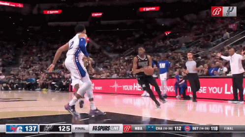 A Basketball Game Is Being Played In Front Of A Banner That Says " Your Heart " GIF
