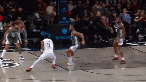A Basketball Game Is Being Played In Front Of A Barclays Advertisement GIF