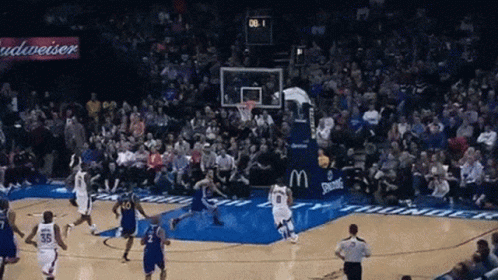 A Basketball Game Is Being Played In Front Of A Budweiser Banner GIF