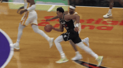 A Basketball Game Is Being Played In Front Of A Capitol Building GIF
