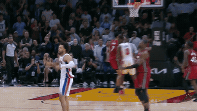 A Basketball Game Is Being Played In Front Of A Crowd And A Kia Sign GIF