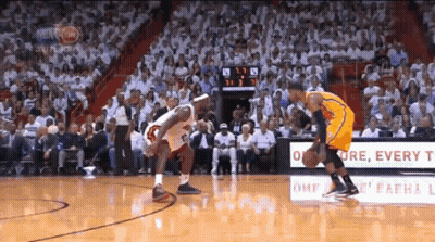 A Basketball Game Is Being Played In Front Of A Crowd And A Sign That Says " Every T " GIF