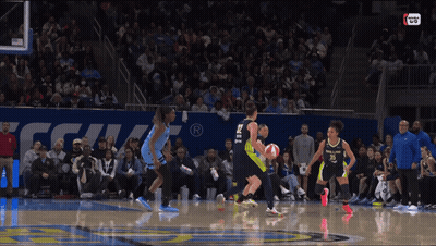 A Basketball Game Is Being Played In Front Of A Crowd And A Sign That Says ' Nba Live ' GIF