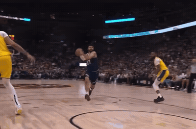 A Basketball Game Is Being Played In Front Of A Crowd And A Sign That Says ' Toyota ' On It GIF