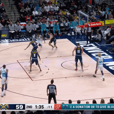A Basketball Game Is Being Played In Front Of A Crowd And The Score Is 59 To 11 GIF