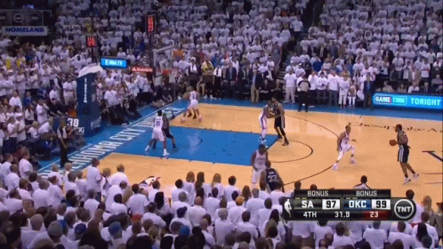 A Basketball Game Is Being Played In Front Of A Crowd And The Score Is 97 To 59 GIF