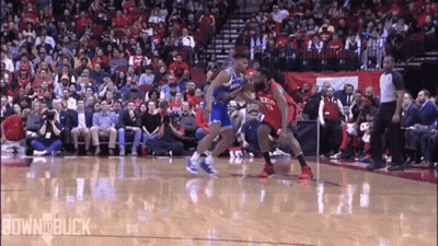 A Basketball Game Is Being Played In Front Of A Crowd Of People GIF
