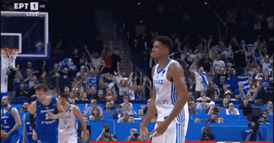 A Basketball Game Is Being Played In Front Of A Crowd That Is Cheering For Their Team GIF