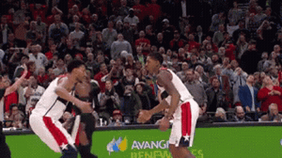 A Basketball Game Is Being Played In Front Of A Crowd That Is Sponsored By Avanti GIF