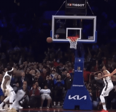 A Basketball Game Is Being Played In Front Of A Crowd That Is Sponsored By Tissot GIF