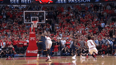A Basketball Game Is Being Played In Front Of A Crowd That Is Wearing Red GIF