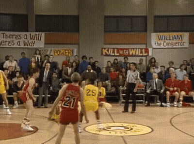 A Basketball Game Is Being Played In Front Of A Crowd With A Banner That Says Kill With Will GIF