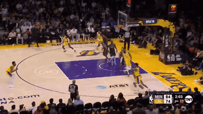 A Basketball Game Is Being Played In Front Of A Crowd With A Scoreboard That Says Tnt On It GIF