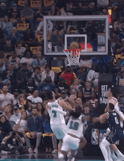A Basketball Game Is Being Played In Front Of A Crowd With A Sign That Says " Play In Purnama " GIF