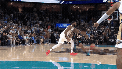 A Basketball Game Is Being Played In Front Of A Crowd With A Sonic Ad On The Wall GIF