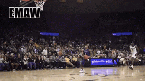 A Basketball Game Is Being Played In Front Of A Crowd With The Word Emaw On The Bottom GIF