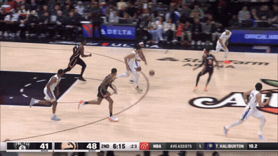 A Basketball Game Is Being Played In Front Of A Delta Banner GIF