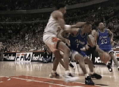A Basketball Game Is Being Played In Front Of A Fila Foot Advertisement GIF