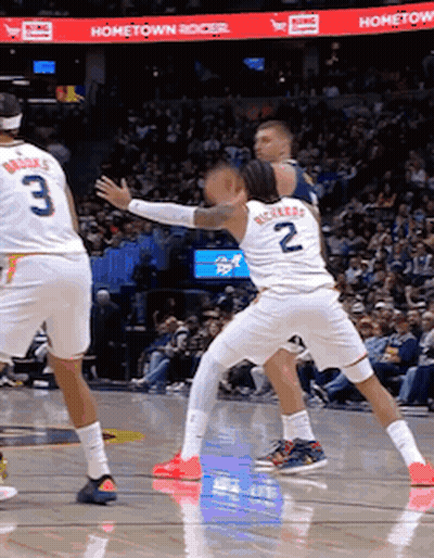 A Basketball Game Is Being Played In Front Of A Hometown Banner GIF
