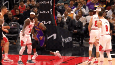 A Basketball Game Is Being Played In Front Of A Kia Ad GIF