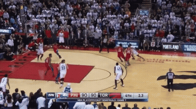 A Basketball Game Is Being Played In Front Of A Large Crowd GIF
