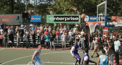 A Basketball Game Is Being Played In Front Of A Large Crowd And A Banner That Says Enterprise GIF