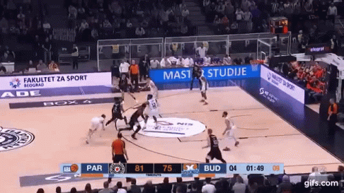 A Basketball Game Is Being Played In Front Of A Large Crowd GIF