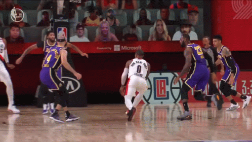 A Basketball Game Is Being Played In Front Of A Microsoft Banner GIF