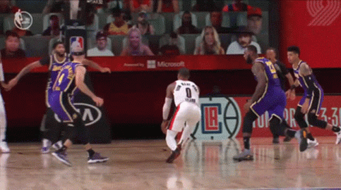 A Basketball Game Is Being Played In Front Of A Microsoft Banner GIF